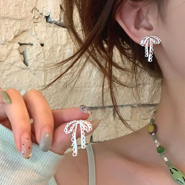 Silver Tone Openwork Bow Stud Earrings with Chain Tassels