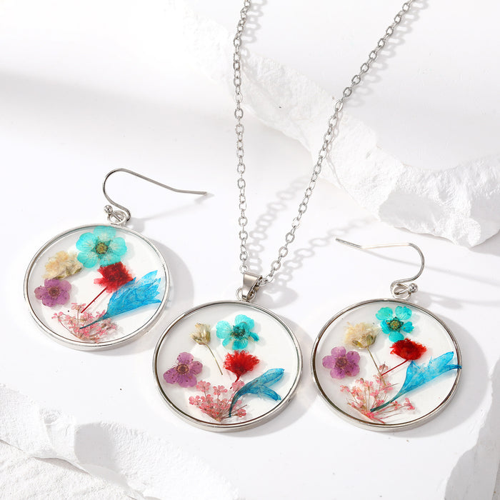 Silver Tone Round Pressed Flower Resin Necklace and Earring Options in Four Designs