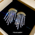 Gold Tone Crescent Earrings with Cascading Crystal Fringe view 3