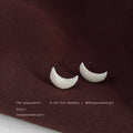 White Pearlescent Crescent Moon Stud Earrings Gold Posts view 1