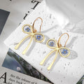 Gold Tone Blue Pressed Flower Resin Hook Earrings in Six Designs view 2