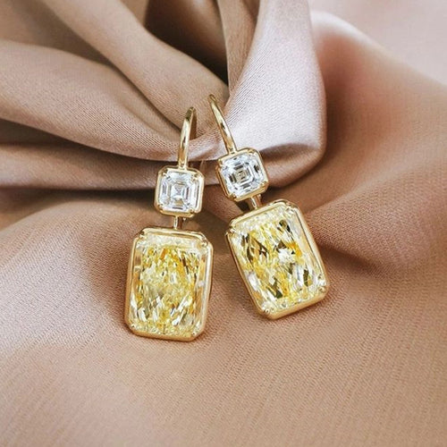Second product view showing gold-tone yellow rectangular two-tier drop earrings