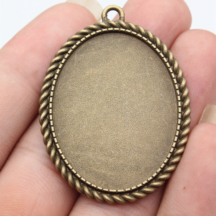 Oval Cabochon Settings in Two Antique Metal Finishes