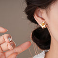 Gold Tone Double Flower Stud Earrings With Decorative Metal Details view 4