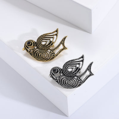 Antique Scrollwork Bird Brooch isolated front view
