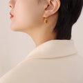 Gold Steel Crescent Bag Shape Textured Hoop Earrings view 4