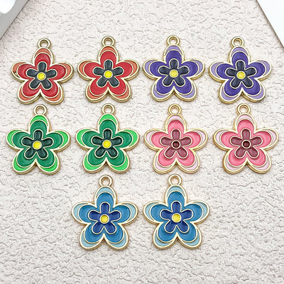 Colorful cake charms arranged on a light background
