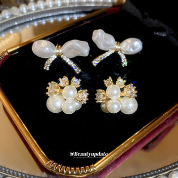 Pearl Bow And Floral Stud Earrings With Polished Metal Tone Details