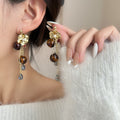 Brown Bead Floral Cluster Gold Tone Long Dangle Earrings view 1