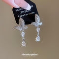 Crystal Butterfly and Teardrop Earrings with Polished Metal Details view 3