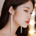 Long White Pearl Look Multi Strand Tassel Earrings view 1