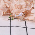 White Enamel Spotted Cat Brooch Gold Branch Green Leaves view 2