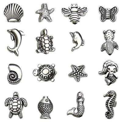 Metallic spacer bead beads arranged on a light background