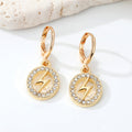 Gold Tone Crystal Heart, Lightning, Eye and Hamsa Huggie Earrings view 3