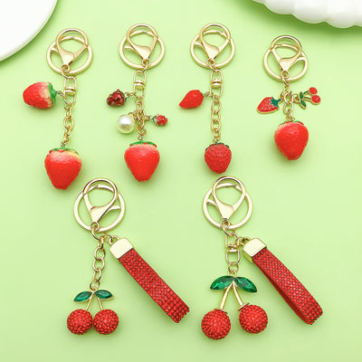 Image 1 showing strawberry key chain.