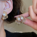 Gold Tone Openwork Pearl Earrings in Two Curled Designs view 2
