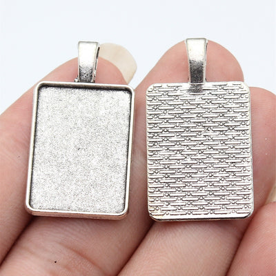 Mixed Metal rectangular pendant bezel tray, close front view