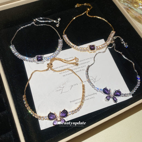 Four purple crystal slider bracelets gold and silver in gift box