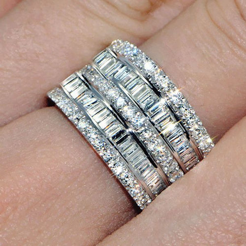 Five-row crystal wide band worn on finger close-up