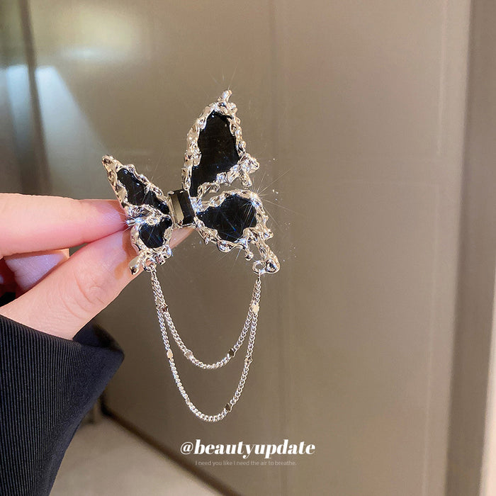 Black Butterfly Brooch With Silver Tone Edges And Draped Chains