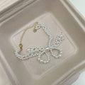 White Pearl Bow Necklace and Bracelet in Two Separate Styles view 6