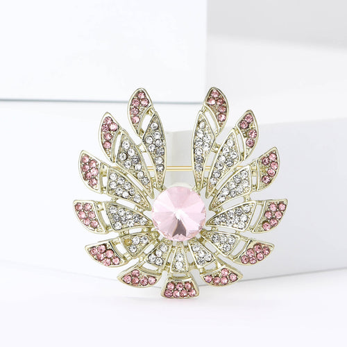 Pink center gold petal flower brooch front on white blocks