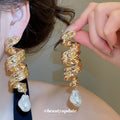 Sculpted Gold Pearl Drop Earrings in Polished Statement Design view 1