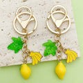 Strawberry, Cherry and Lemon Charm Keychains Featuring Yellow Lemon Across 43 Variations view 1