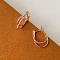 Rose Gold Crossed X Pave CZ Huggie Hoop Earrings Metal view 3