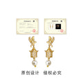 Gold Tone Flying Bird Cage And White Pearl Drop Earrings For Women view 3