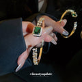 Gold Tone Green Rectangle Open Bangle With Clear Crystal Sides view 2