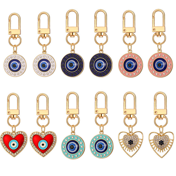 Twelve Piece Gold Tone Heart and Round Evil Eye Clip Keychain Set
