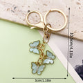 Butterfly Charm Keychains Featuring Blue Butterfly Across 35 Pictured Variations view 4