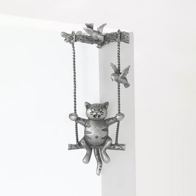 Antique Silver Cat on a Swing Brooch With Bird Details shown from the front on a white background