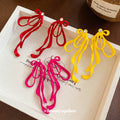 Colorful Cord Bow Stud Earrings with Long Looped Ribbon Tails view 2