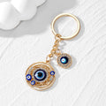 Gold and Silver Tone Openwork Heart and Round Evil Eye Keychains view 2