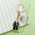 Graduation Charm Keychains Featuring Flower Across 31 Pictured Variations view 11