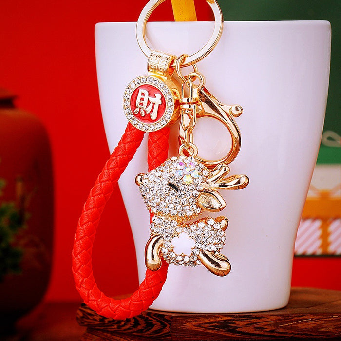 Crystal Sitting Deer Keychains with Gold Tone Rings and Braided Straps
