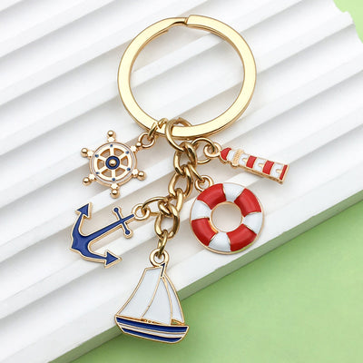 Image 1 showing a key chain with various nautical themed items.