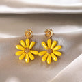 Yellow Daisy Drop Earrings with Textured Brown Centers view 6