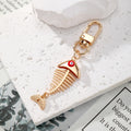 Gold Tone Fish Skeleton Evil Eye Clip Keychains in Five Colors view 5