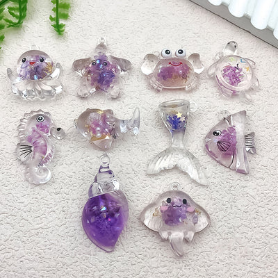 Purple turtle charms arranged on a light background