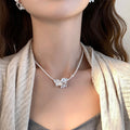 White Pearl Strand Necklace with Floral Center Accent view 3