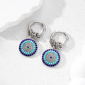 Gold and Silver Tone Multi Ring Crystal Evil Eye Huggie Earrings view 2