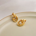 Twelve Gold Tone Sculptural Knot and Hoop Earrings view 11