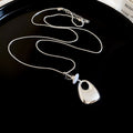 Silver Tone Abstract Pendant Necklace with Clear Crystal view 6