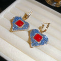 Red and Blue Geometric Crystal Drop Earrings with Polished Metal Details view 1