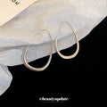 Polished Teardrop Hook Earrings In Gold And Silver view 3