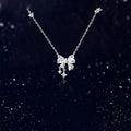 Silver Tone Crystal Bow Pendant Necklace With Dangles view 2
