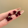 Red Flocked Horse Bow Stud Earrings with Distinctive Textured Details view 3